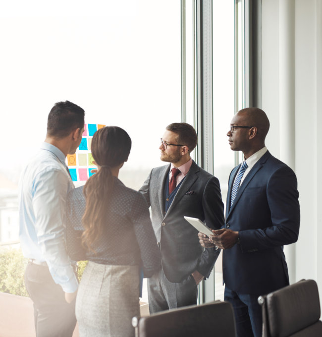 three person having discussion