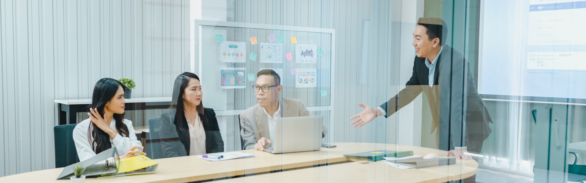 four professionals having discussion