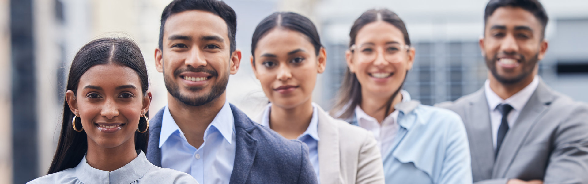 Confident Team of Professionals Standing Together Outdoors